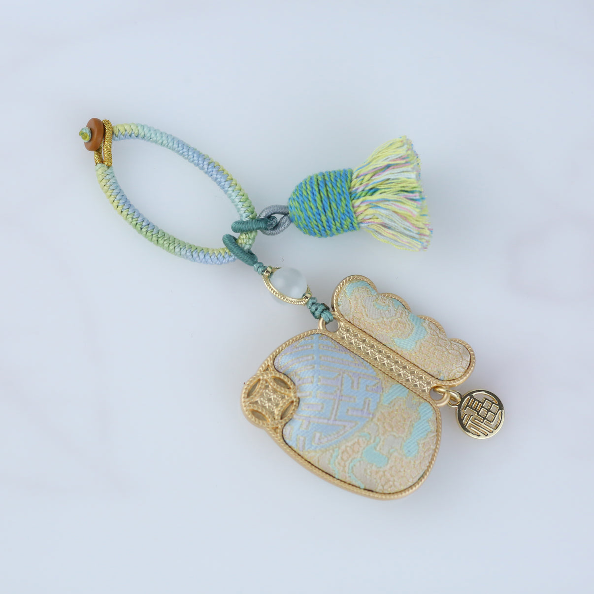 Handmade Song brocade car rear view mirror pendant with silk tassel, a Chinese lucky charm for good luck and protection.
